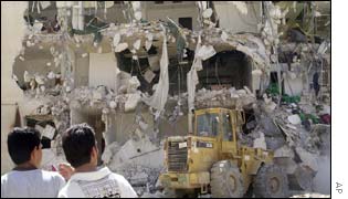 A Palestinian bulldozer works to clear rubble in Yasser Arafat's compound in Ramallah 