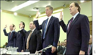 Global Crossing Chairman Gary Winnick (far right), and other current and former Global Crossing executives are sworn in before a Congressional committee