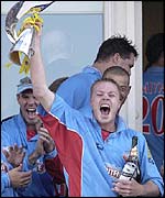 Martin Saggers holds aloft the National League trophy