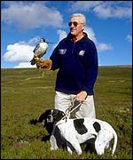 Scotland coach Jim Telfer with falcon and spaniel