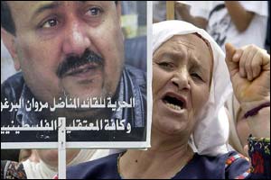 Palestinian woman with a placard supporting Barghouti (photograph courtesy of AFP)