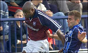 Finidi George fends off a challenge from Sartid's Milorad Zecevic