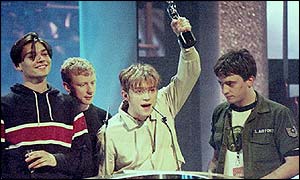 Blur accept an award in 1995 with Graham Coxon (r)