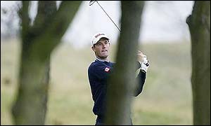 Padraig Harrington plays through the trees at Kingsbarn