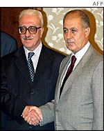 President Sezer (R) greets visiting top Iraqi official Tarik Aziz on 1 October