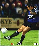 Tommy Hayes kicks over for Glasgow