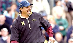 Eduardo Romero shares the lead with Padraig Harrington after the third round; the pair finish on 16 under for the championship, three shots clear of the chasing pack