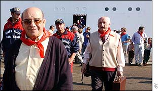 Manuel Nevado Rey (left) arriving at a port near Rome