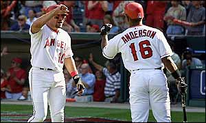 Benji Gil (left) of the Anaheim Angels is congratulated by teammate Garret Anderson 