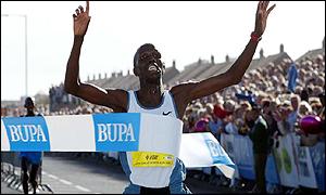 Paul Kosgei crosses the finishing line