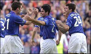 Mikel Arteta celebrates with his team-mates after giving Rangers the lead