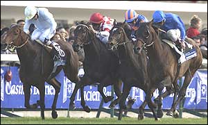 Frankie Dettori on Marienbard (right) wins the Prix de l'Arc de Triomphe