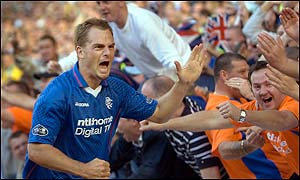Ronald de Boer celebrates after scoring for Rangers