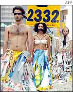 People dress in election poster scraps to protest against litter