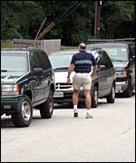 Parents waiting with their cars to pick up children