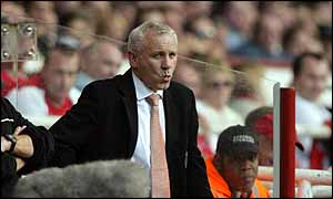Peter Reid watches his side go down 3-1 at Arsenal