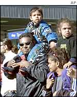 An Aboriginal family joined hundreds of Australian Aboriginals marching in Sydney, July 2002