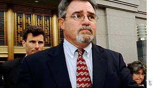 Buford Yates, centre, former accounting executive at WorldCom leaves US District Court in New York after pleading guilty to securities fraud and conspiracy. 
