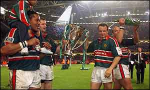 Leicester players celebrate with the Heineken Cup in Cardiff