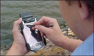 Man using PDA device