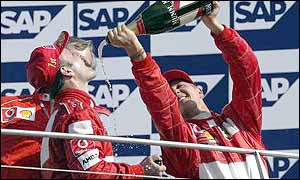 Ferrari's Rubens Barrichello (left) and Michael Schumacher celebrate yet another one-two finish