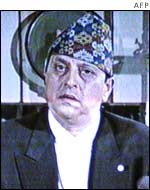 King Gyandendra on television announcing the dissolution of the government