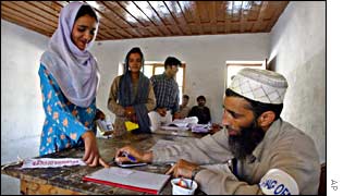 An Indian voter is marked before casting her vote 
