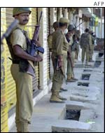 Police officers at a polling booth in Doda, Kashmir