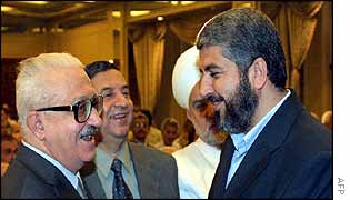 Tariq Aziz (L) meets Hamas political leader Khaled Meshaal at the Damascus conference