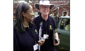 Election observers Acha Morfaw, left, and Douglas Kidd, second from left (photographs courtesy of AP)