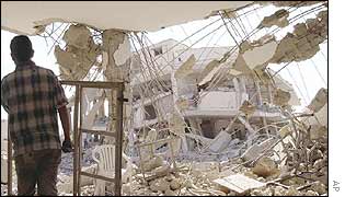 A Palestinian man inspects the damage in buildings at the Palestinian leader Yasser Arafat�s compound in Ramallah