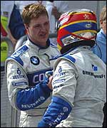 Ralf Schumacher (left) and Juan Pablo Montoya congratulate each other on their one-two finish in Malaysia