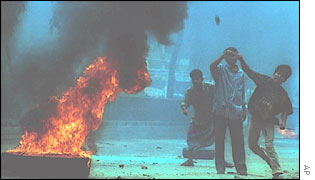 Demonstrators hurling fire bombs