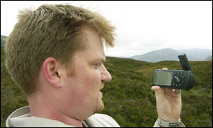 Author stands at centre of Scotland, checking the GPS