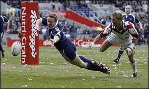 Wigan full back Kris Radlinski goes for a try