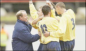 Berti Vogts celebrates with the Scotland team