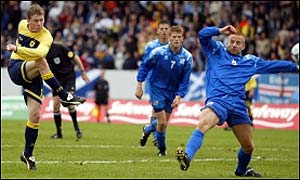 Gary Naysmith drives home Scotland's second goal