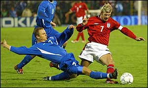 Slovakia's Attila Pinte tackles England's David Beckham