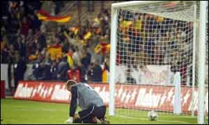 Northern Ireland keeper Maik Taylor is left stranded as Spain grab a third