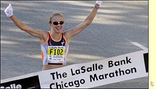 Paula Radcliffe crosses the line to break the world record and add the Chicago marathon to her earlier victory in London