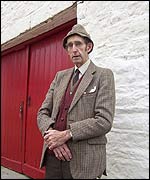 John Morgan outside a barn on his farm