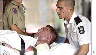 Injured survivor arrives at a hospital in Darwin having been airlifted from Bali