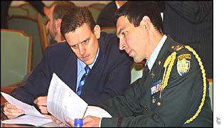 Investigators - including (right) a US military officer