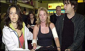 Melanie Cohen (centre), 30, is met by relatives