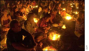 Foreigners pray on the beach at Peti Tenget, near Denpasar, Bali