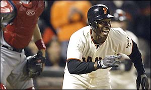Kenny Lofton sees his hit win the game for the Giants