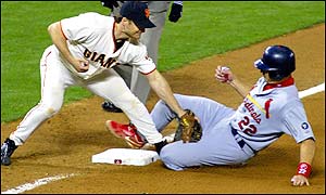 St. Louis Cardinals' Mike Matheny is safe at third base