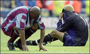 Aston Villa's Dion Dublin and David James contemplate defeat to Chelsea in the 2000 FA Cup final 