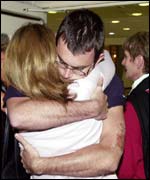 Jonathan Hartery is hugged by his mother