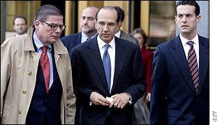 Disgraced ImClone founder Sam Waksal, centre. flanked by his lawyers, leaves Federal Court after pleading guilty.